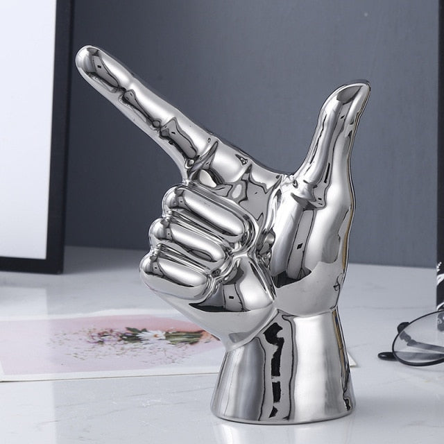 POINTING HAND STATUES