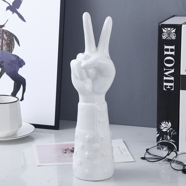 POINTING HAND STATUES