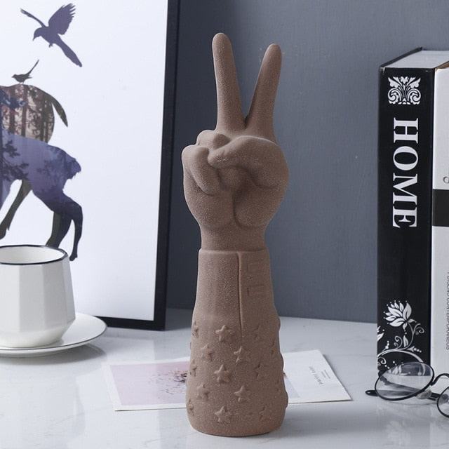 POINTING HAND STATUES